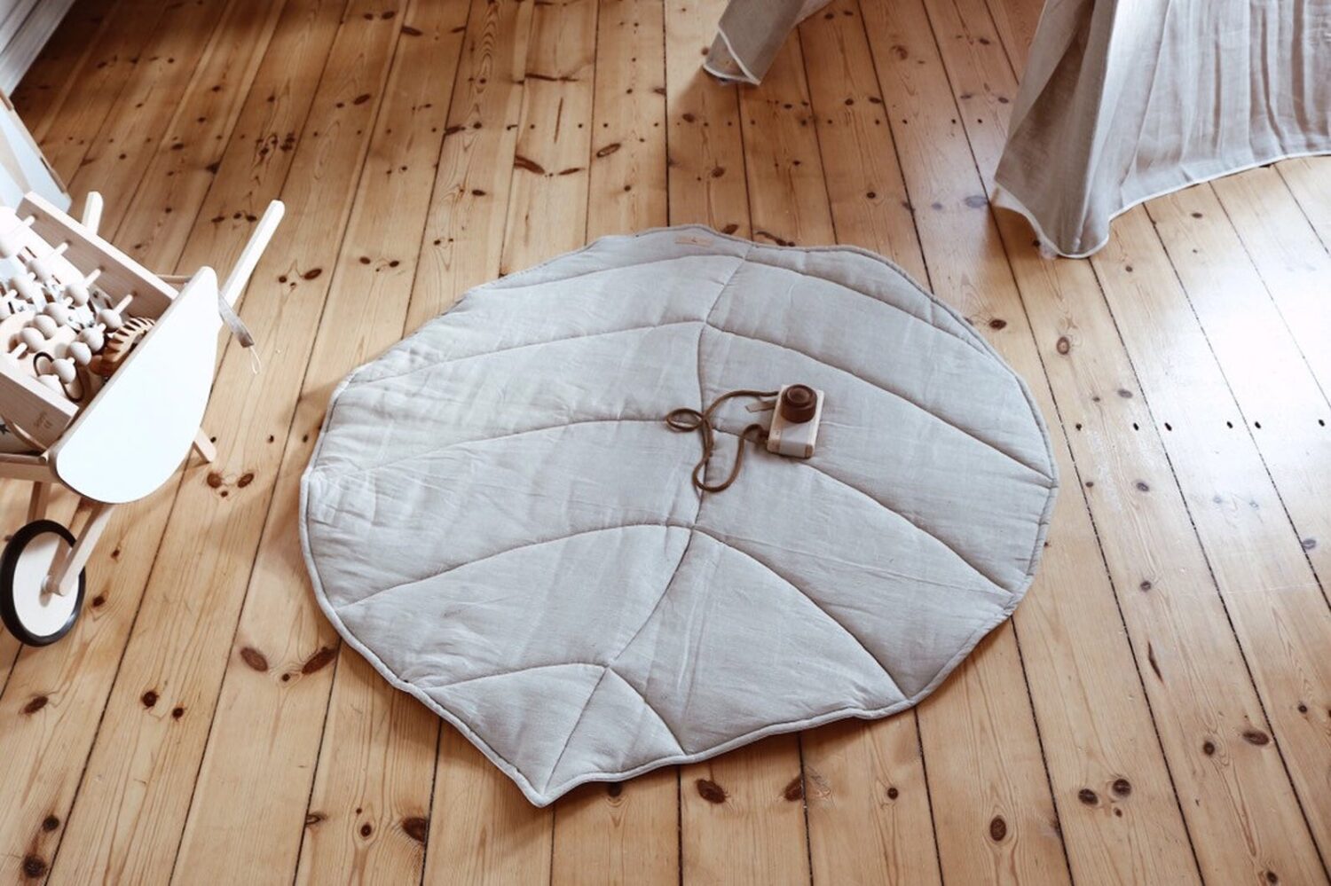 Linen tipi tent with leaf mat